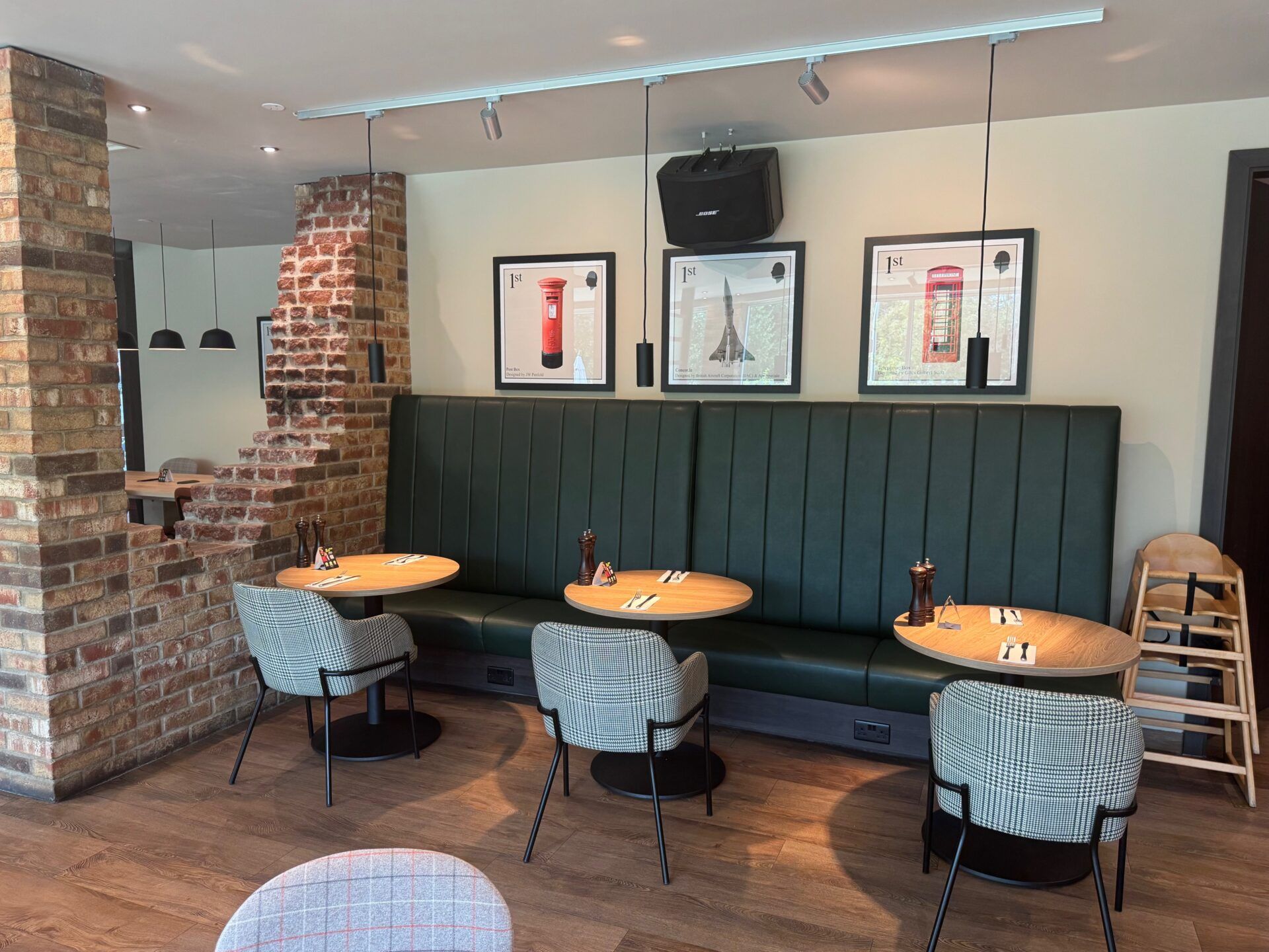 B&B Hotel Warrington B&B Hotel Warrington dining area with stylish seating, exposed brick wall, and British-themed art for a unique ambiance.