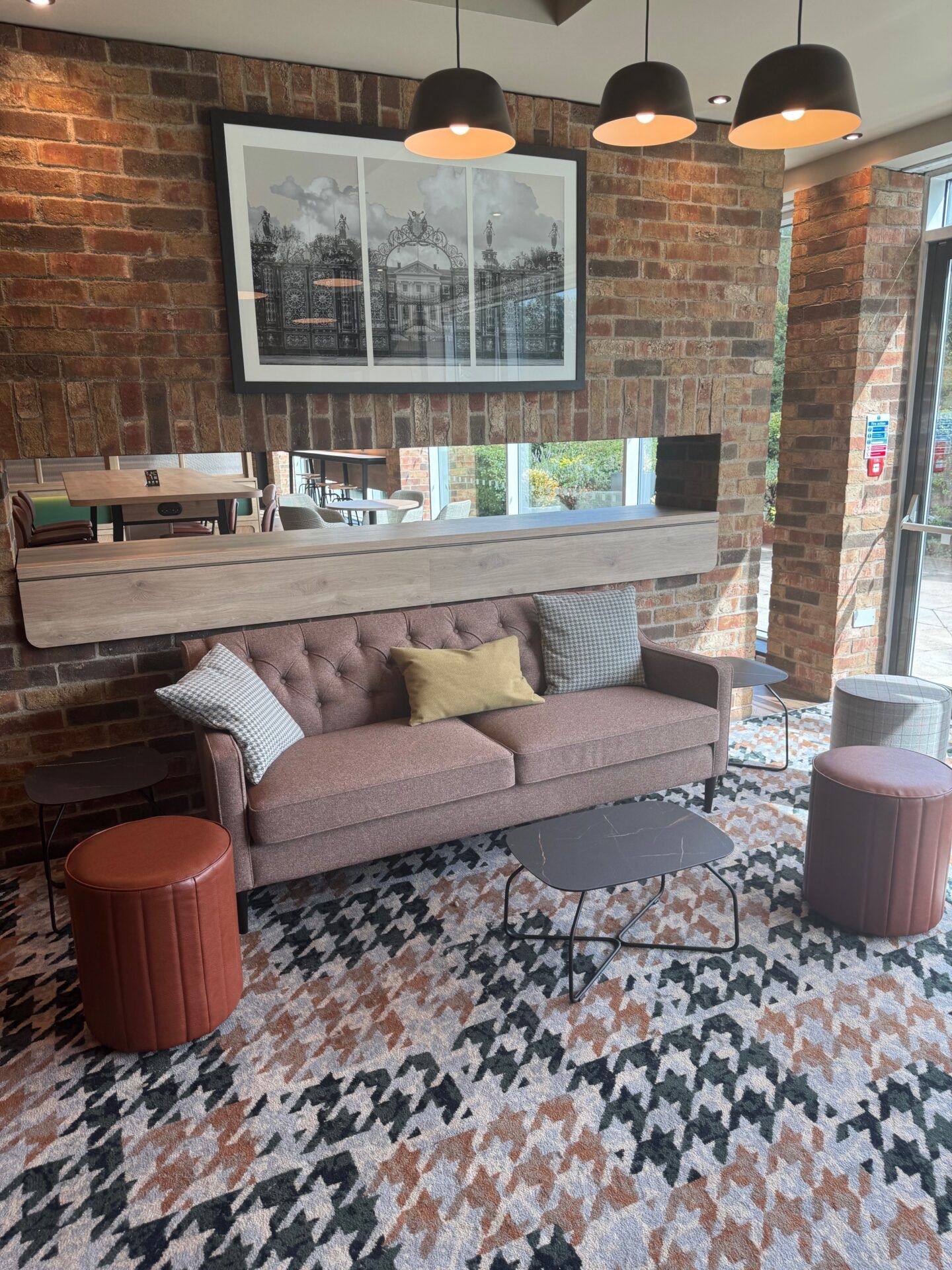 B&B Hotel Warrington B&B Hotel Warrington lobby area with stylish seating, brick wall, and modern decor. Comfortable and inviting space.
