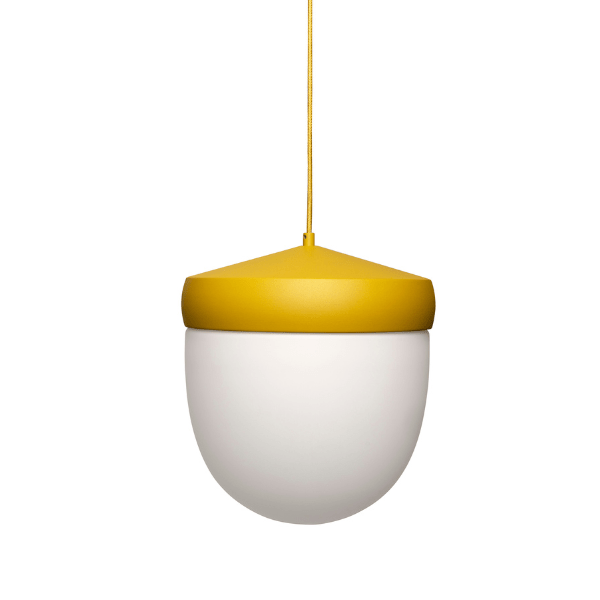 Studio shot of Pan Small Pendant Light showcasing its yellow metal frame and opaque white glass bulb, hanging from a yellow cord.