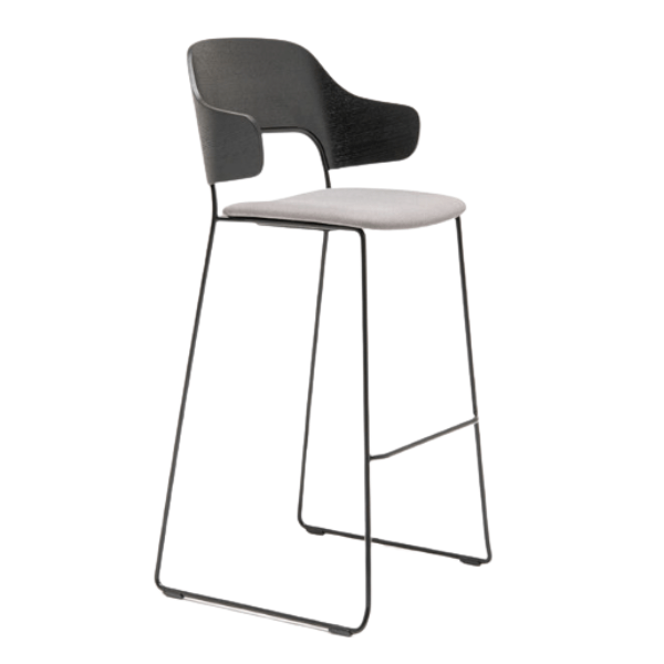 Afi Barstool, side view. Features a black metal frame, gray upholstered seat, and a wooden back with armrests. Modern design.
