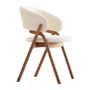 Side view of a Giulia Armchair featuring cream upholstery and a natural wood frame, showcasing its modern design.