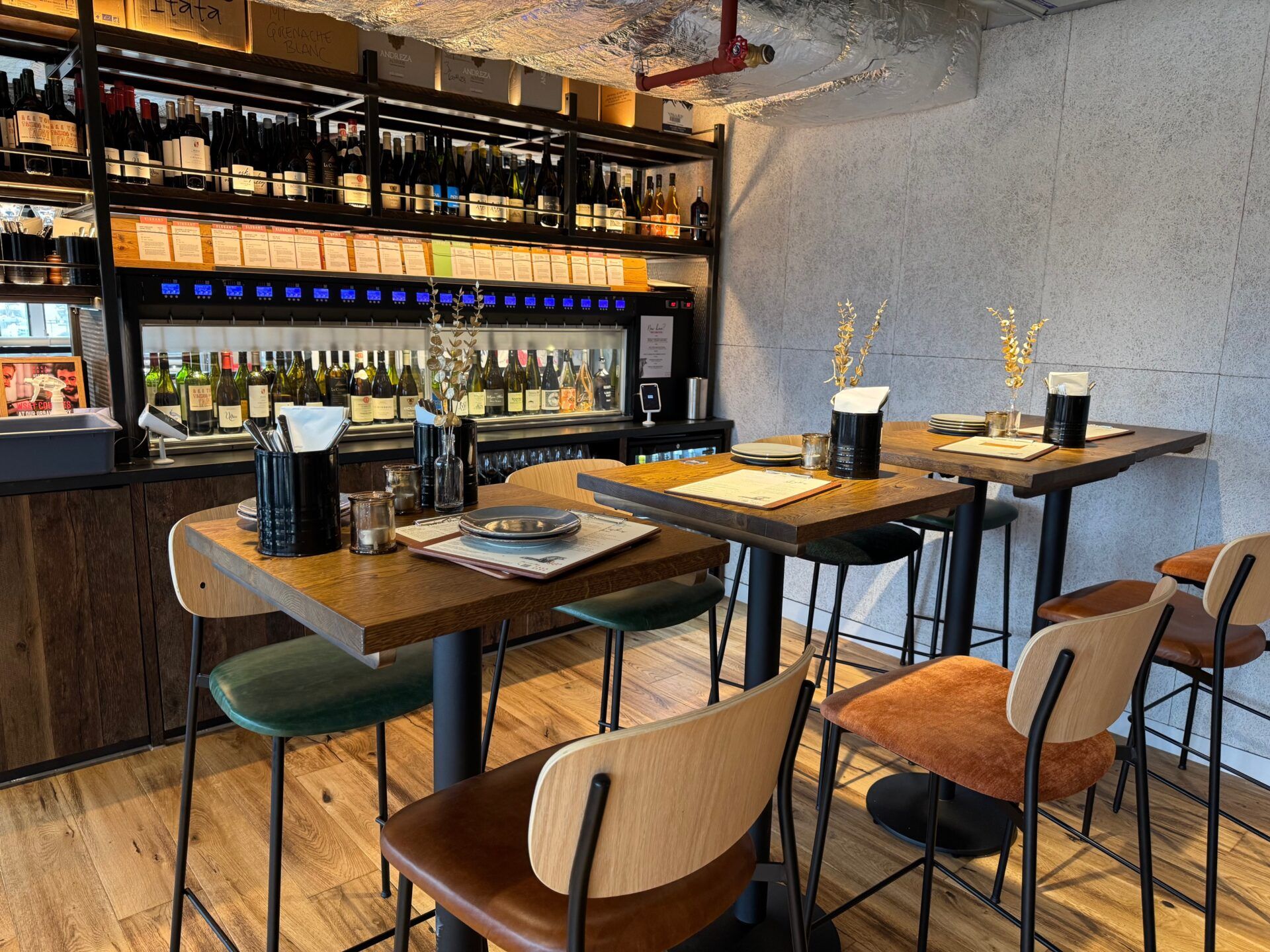 Vagabond Urban Winery London: Interior view with wine racks, tables, and seating, showcasing the project's design.