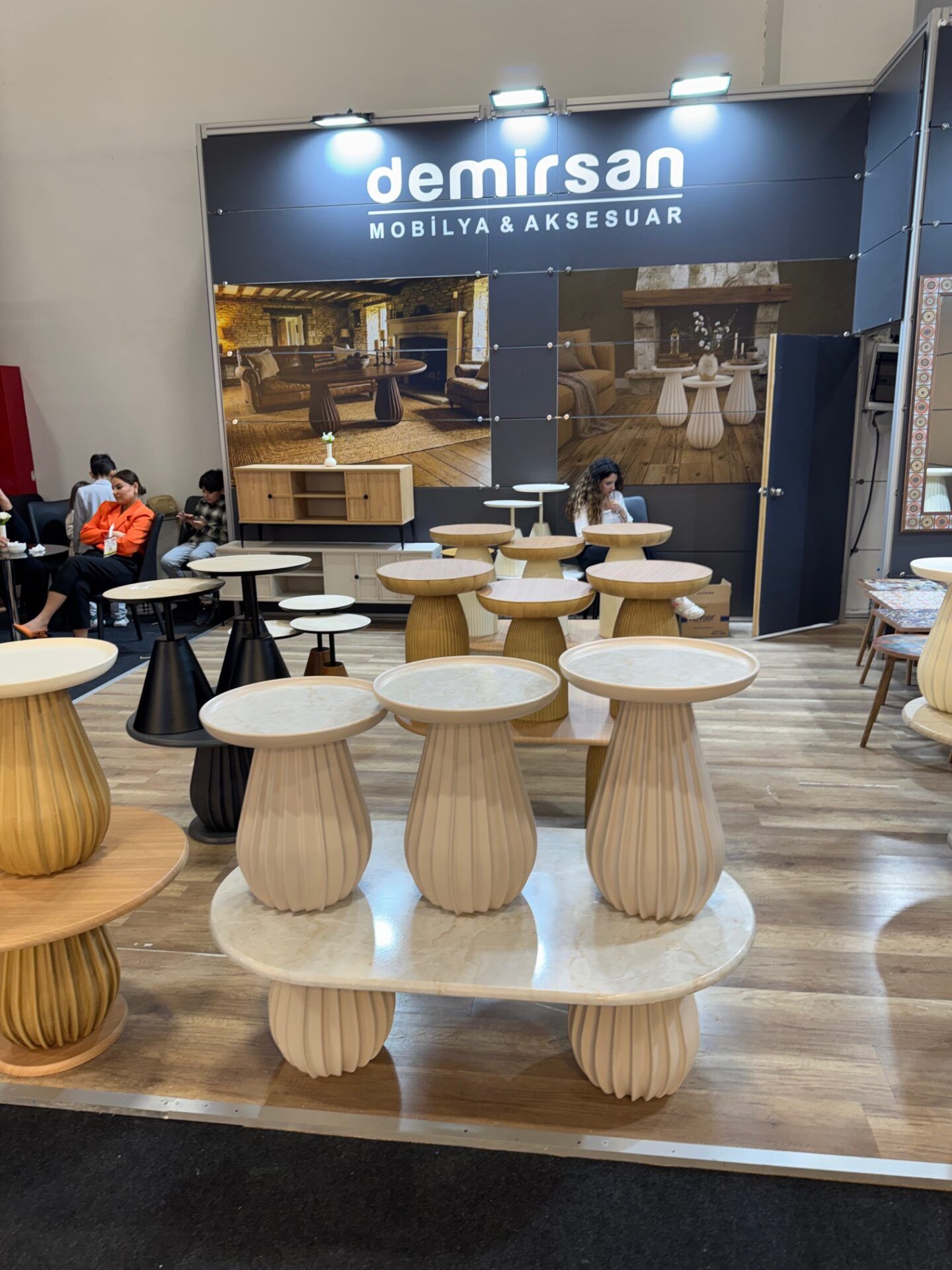 Demirsan furniture display at Istanbul Furniture Fair, showcasing modern wood furniture and design highlights.
