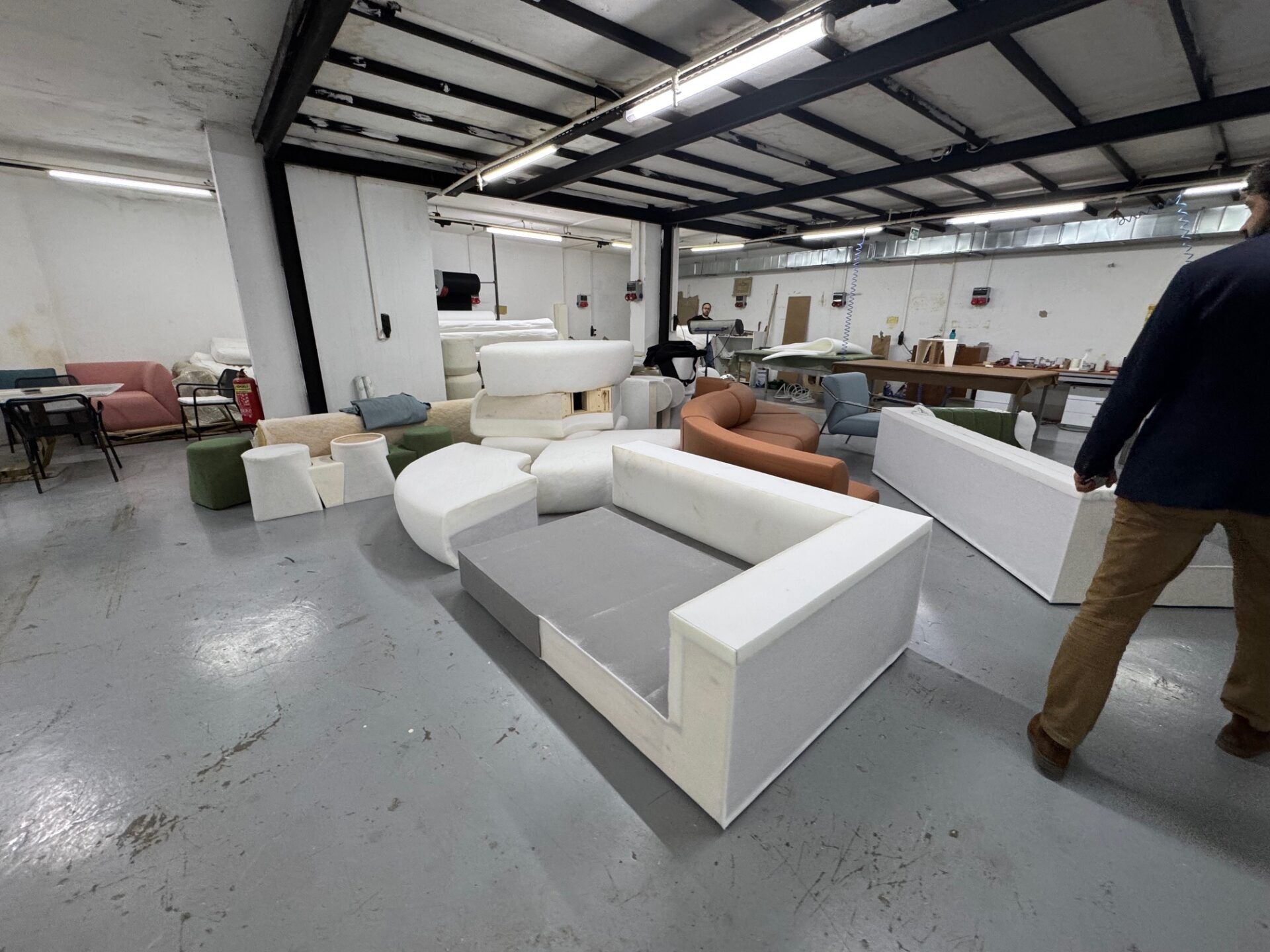 Istanbul Furniture Fair: Upholstery workshop with sofa components and modern furniture design elements. Industry inspiration.