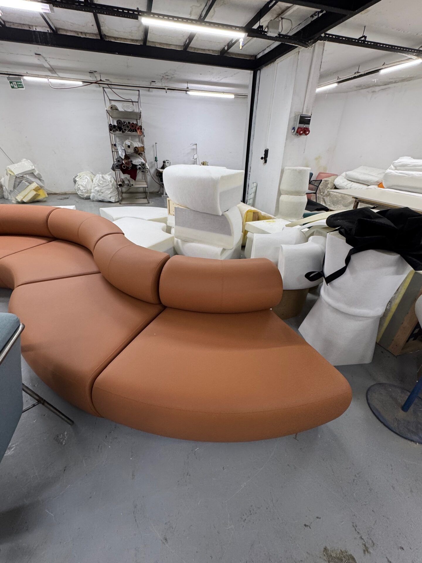 Istanbul Furniture Fair: Close-up of a caramel-colored, uniquely designed sofa, showcasing furniture design inspiration.