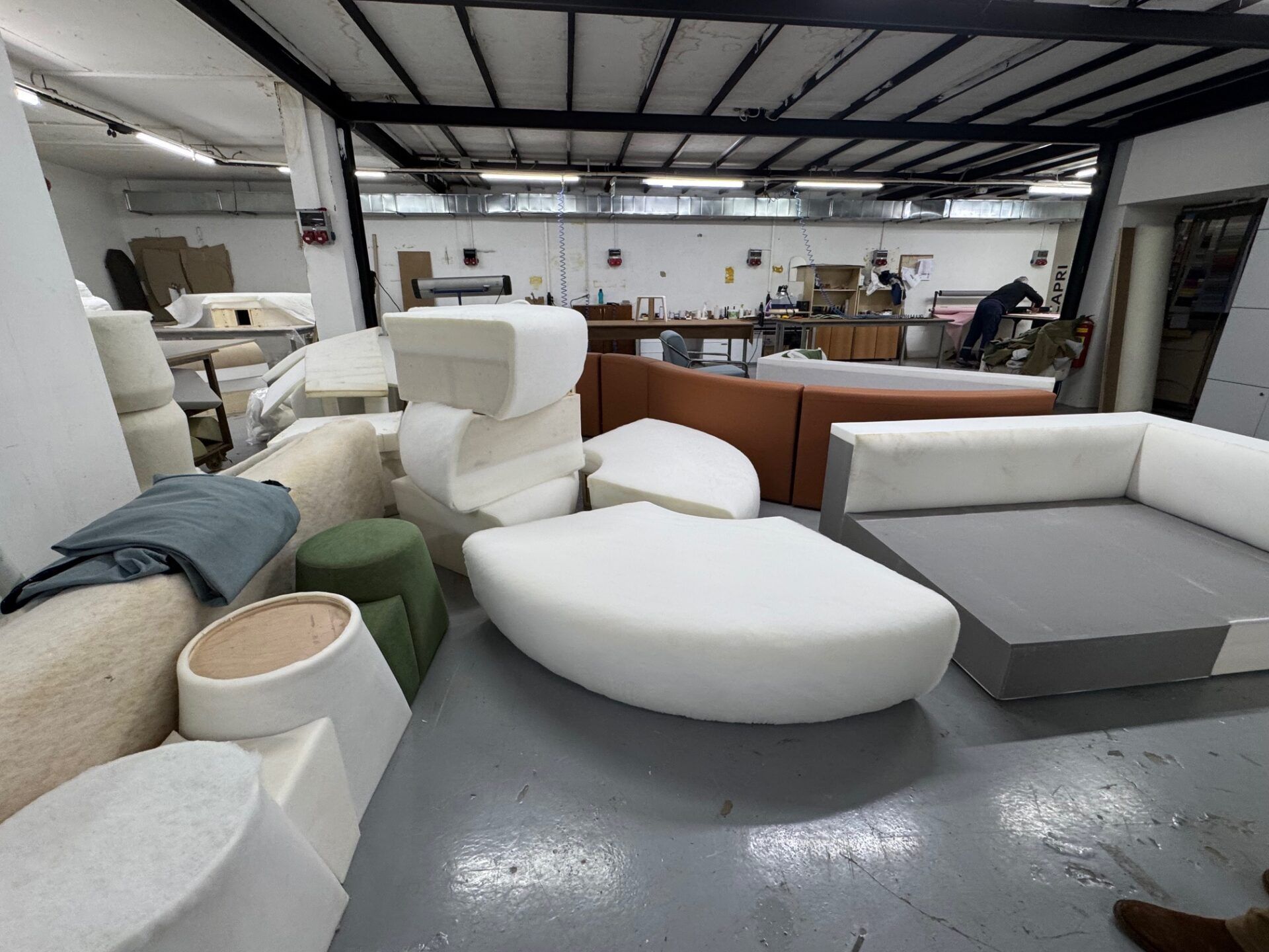 Istanbul Furniture Fair design highlights: Upholstery materials and furniture components in a workshop setting. Industry inspiration.