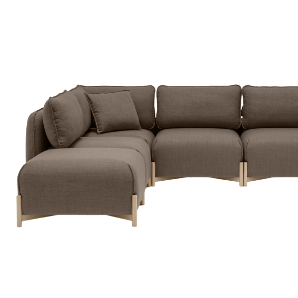 Studio shot of a brown Linka Corner Sofa, featuring a modular design with upholstered seats and back, and light wood frame.