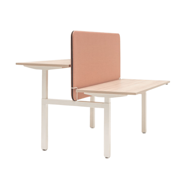 Angled view of a Sonic Sit Stand Desk Screen featuring salmon fabric, light wood desks, and a white metal frame.