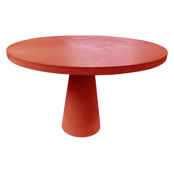Red Concrete Dining Table with round top and conical base, minimalist style.