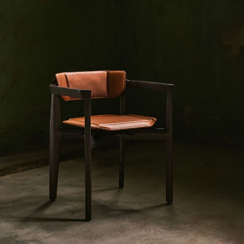 Stylish Rasa Armchair: Brown leather upholstered seat and back, dark wood frame. Contemporary lounge chair for commercial environments.