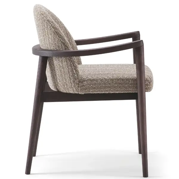 Side view of an Arlo Armchair, featuring a wooden frame and upholstered seat and back in neutral fabric.