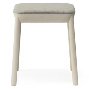 Front view of Drum Low Stool with a wooden frame and upholstered seat in a neutral color, ideal for lounge areas.