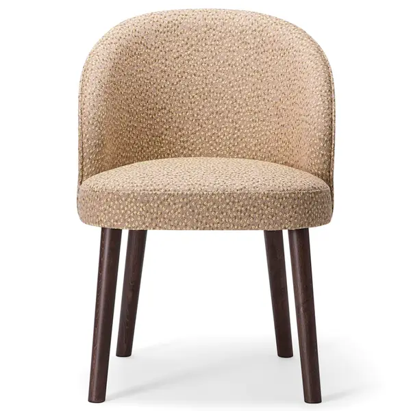 Front view of Ginger 060 Armchair featuring textured beige upholstery and dark wood legs.