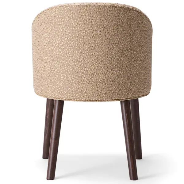 Rear view of Ginger 060 Armchair featuring upholstered tan fabric and dark wood legs, blending comfort and modern style.