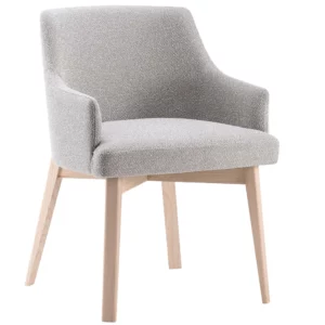 Kora Armchair, angled view. Light grey upholstered seat and back, pale wood frame, contemporary design for commercial interiors.