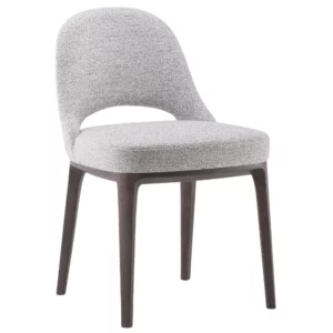 Angled view of the Lea T Side Chair, featuring gray upholstery, wood frame, and a cutout in the back.