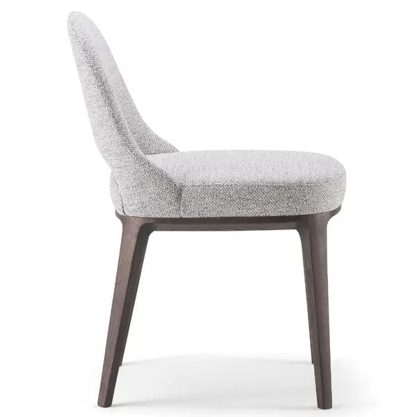 Side view of the Lea T Side Chair showcasing a light gray upholstered seat and back with a dark wood frame.