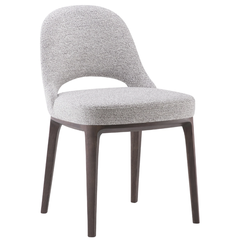Angled view of the Lea T Side Chair, featuring gray upholstery, wood frame, and a cutout in the back.