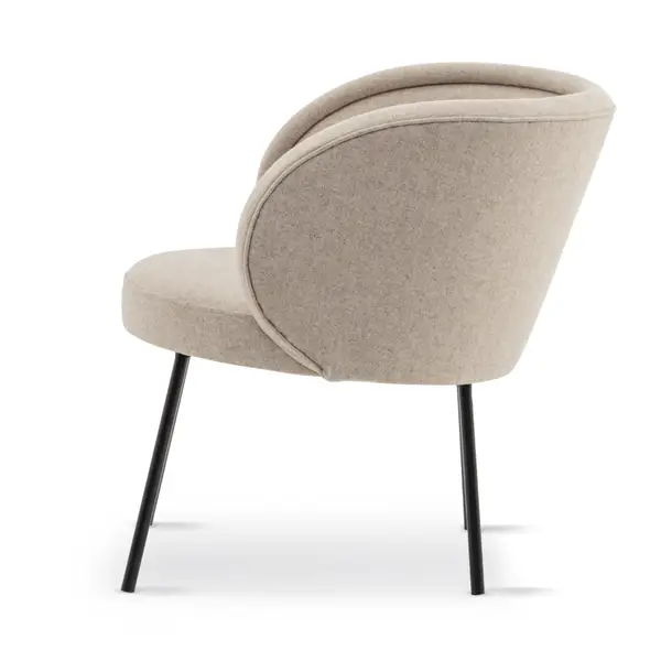 Side view of the Luna Lounge Chair in beige upholstery with black metal legs, showcasing its curved back and modern design.