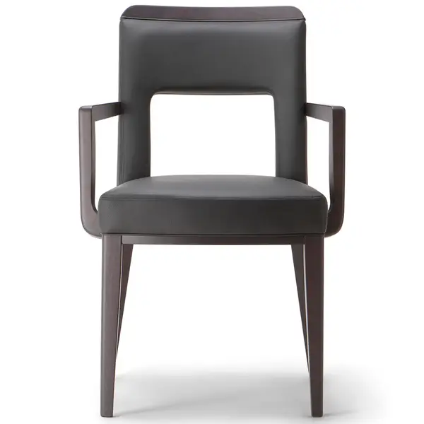 Front view of Montreal W Armchair, featuring dark leather upholstery, wood frame, show wood detail, for hospitality and workplace environments.
