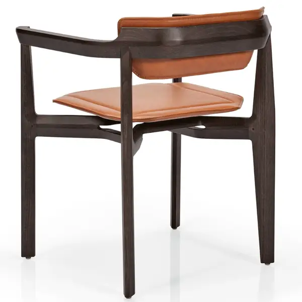 Back view of the Rasa Armchair, featuring a dark wood frame and upholstered seat and back in tan colored leather.