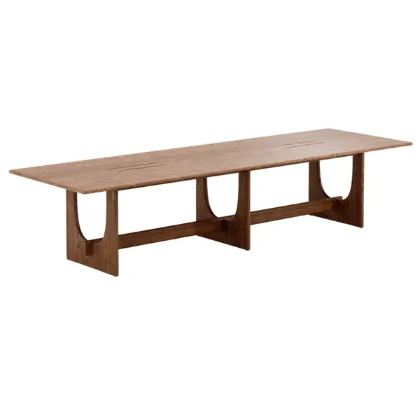 Full view of a wooden Sund Conference Table, featuring a solid light brown timber top and shaped leg supports on a white background.