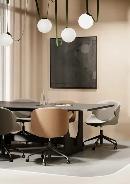 Contemporary Sund Dining Table with a metal frame and Y-shape detail, surrounded by modern chairs in a neutral-toned room.