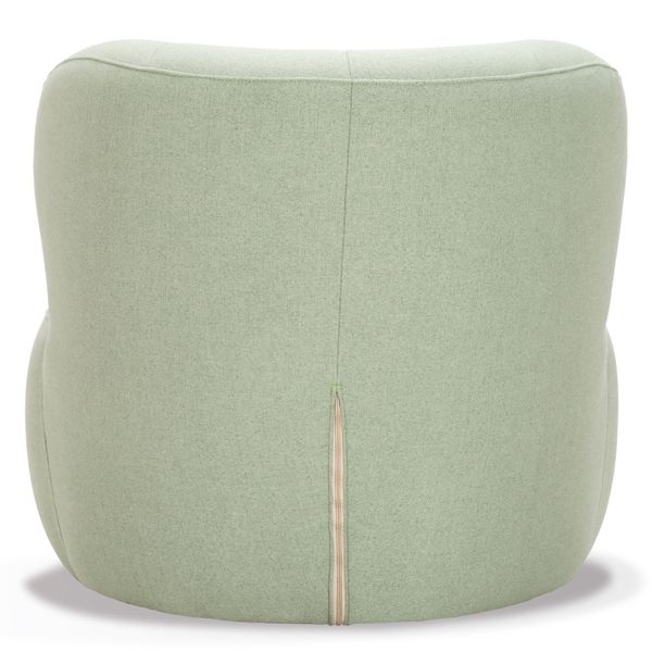 Back view of the Rose Chaise Lounge, upholstered in light green fabric, showcasing its contemporary sculptural shape and comfortable support.