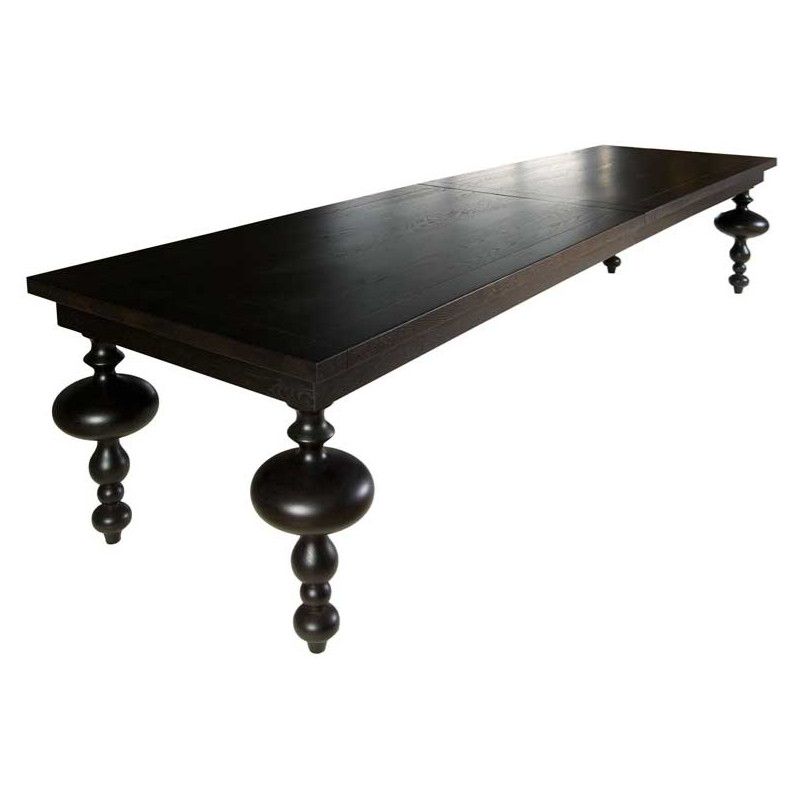 Angled view of the dark wood Marie Rectangle Dining Table with ornate turned legs, showcasing its smooth top and crafted details.