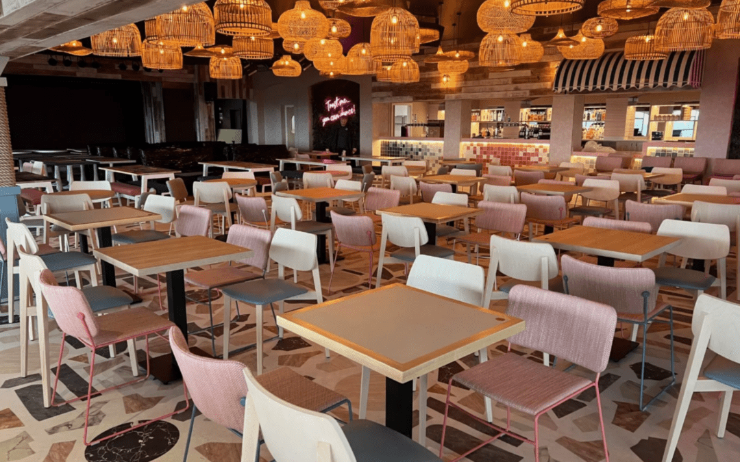 Stylish restaurant interior featuring durable dining tables, chairs, and warm hanging lights for lasting furniture.