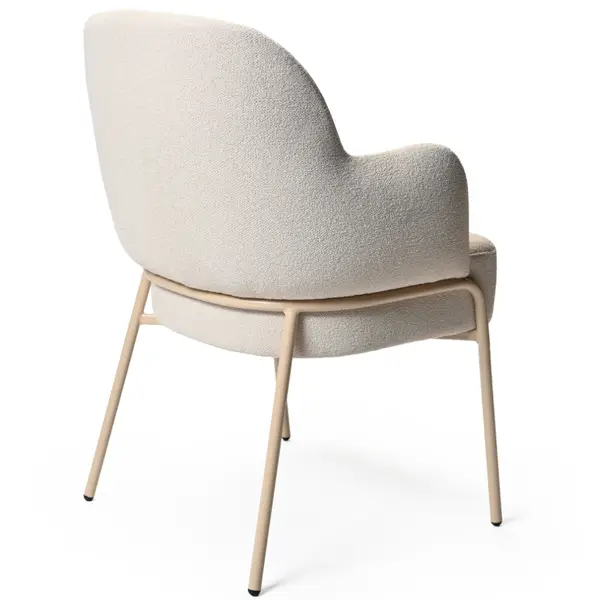 Rear view of cream boucle Adele Armchair with metal frame. Modern upholstered accent chair for hospitality and home.
