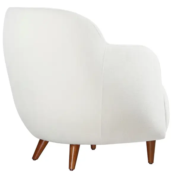 Rear view of Glamour Lounge Chair in white upholstery with wooden legs, showcasing its curved design and tailored details.