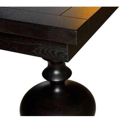 Close-up shows the dark wood of the Marie Rectangle Dining Table, highlighting the rounded base and detailed turned leg design.