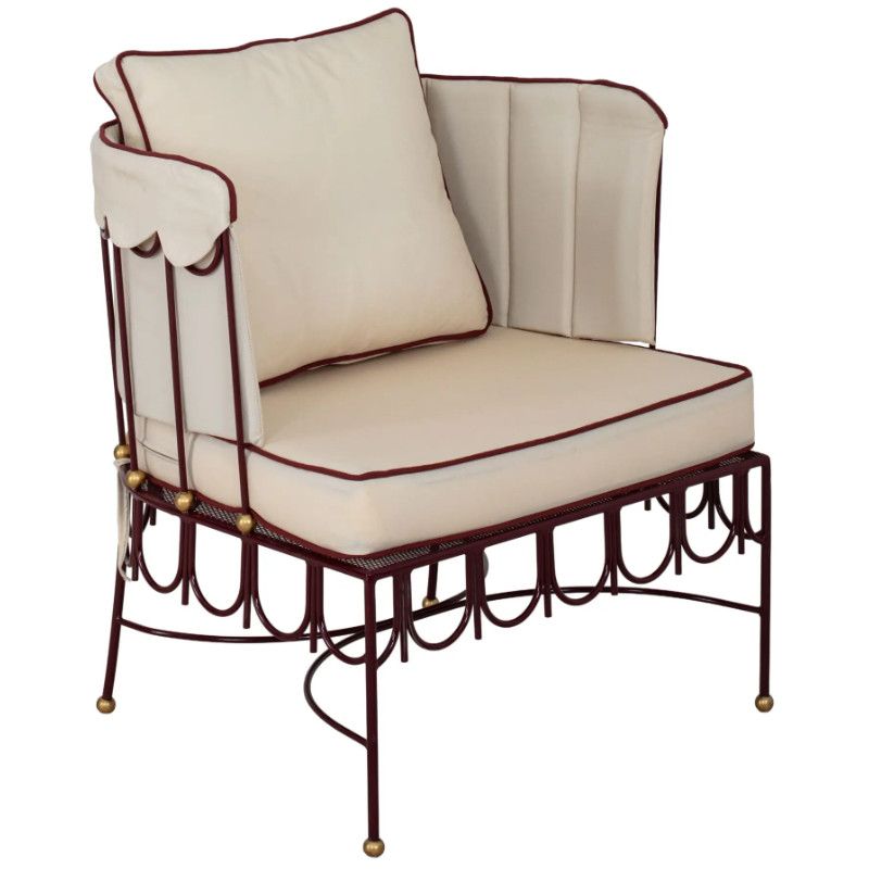 Halycon Lounge Chair with a maroon metal frame, cream upholstered seat, and red contrast piping in a side view.