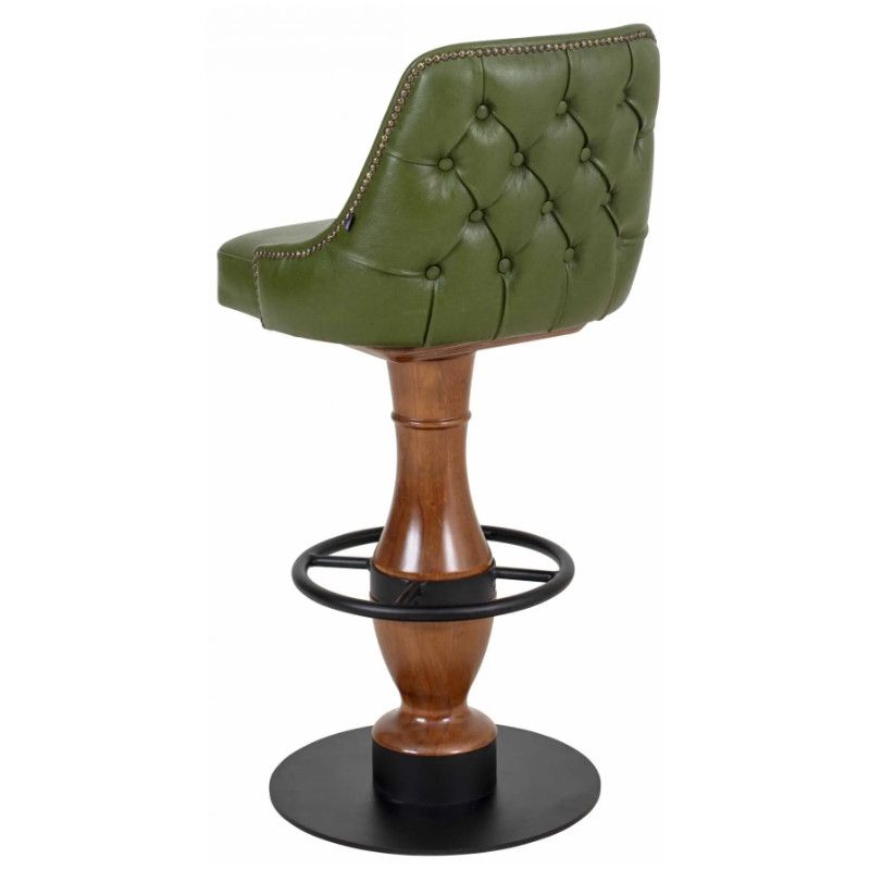 Rear view of a Mungo Barstool featuring tufted olive leather upholstery with stud detailing on a turned wooden column base.