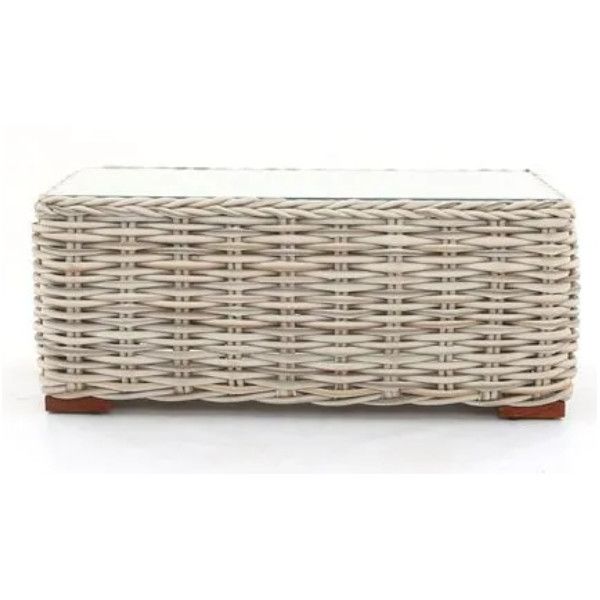 Close-up of the Tula coffee table showing the intricate light-toned woven frame and clear top against a white background.