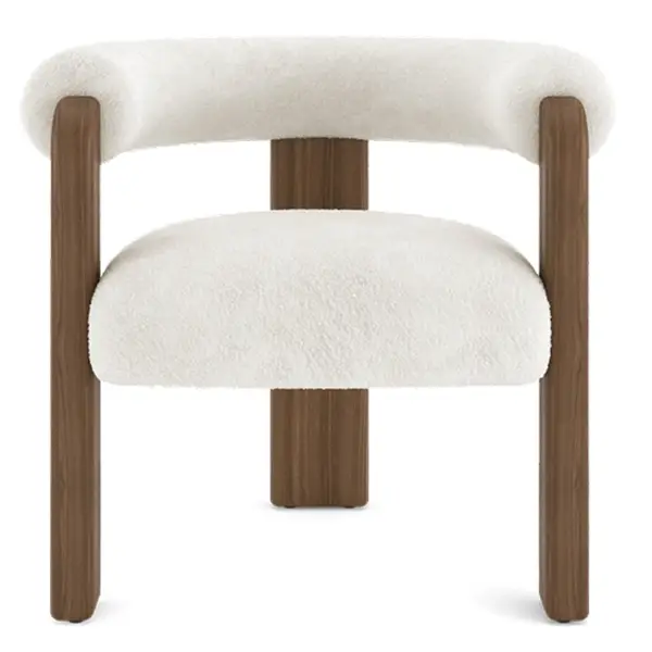 Close-up of the Auro Armchair showing the junction between the soft white seat and the distinct vertical walnut support.