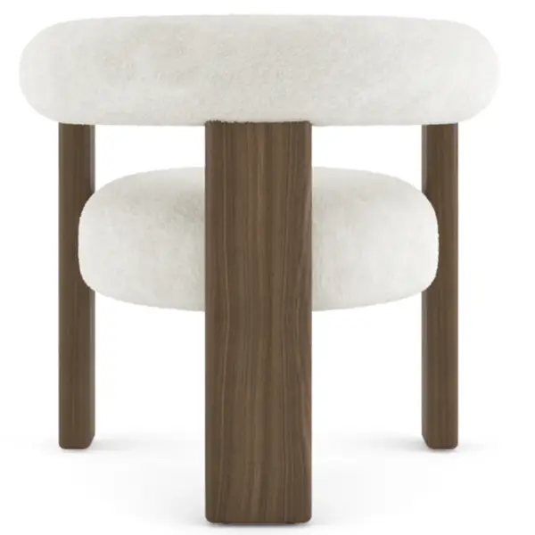 Direct front-on view of the Auro Armchair highlighting its plush off-white circular seat and bold walnut-toned legs.