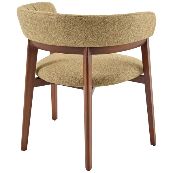 Rear view of the Cora Armchair showing its textured olive fabric upholstery and polished wooden frame legs.