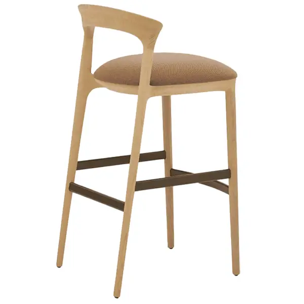 Rear view of the Fau Barstool featuring a natural wood frame, curved back, and tan fabric seat with footrest detail.