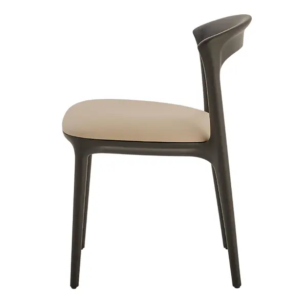Profile view of the Fau Side Chair, highlighting its minimalist wooden silhouette and soft beige seat cushion.
