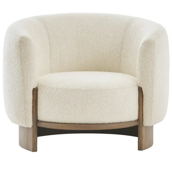 Front view of the Hug Lounge Chair featuring plush cream boucle upholstery and a curved solid wood base.