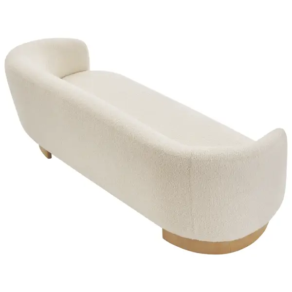 High-angle view of the Hug Sofa, showcasing its ergonomic rounded silhouette, ivory upholstery, and wooden base.