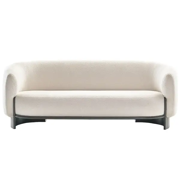 Close-up studio shot of the Hug Sofa, highlighting its off-white upholstered body and dark wood sled base from the front.