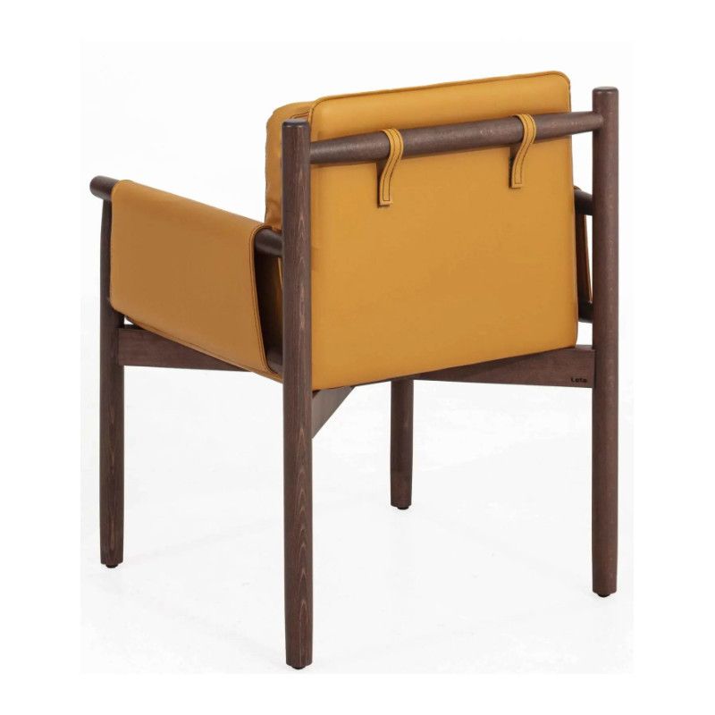 Rear perspective of the Merinal armchair, highlighting mustard yellow upholstery and the dark wooden frame structure.