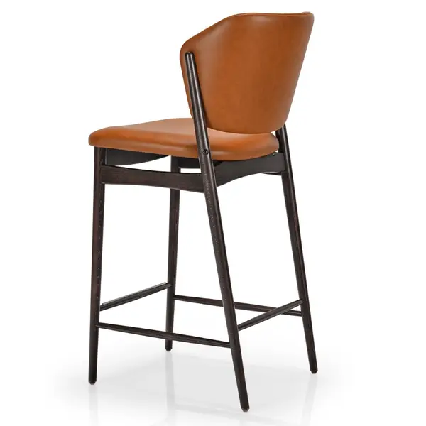 Rear-facing view of the Silene barstool featuring a rich brown leather seat and a dark wooden frame with base supports.