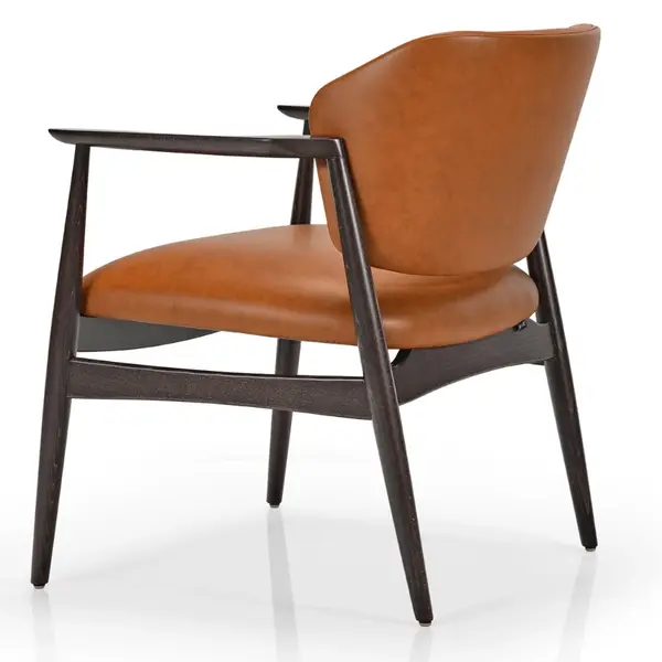 Rear three-quarter view of the Silene lounge chair featuring brown upholstery and a sleek dark wood frame.