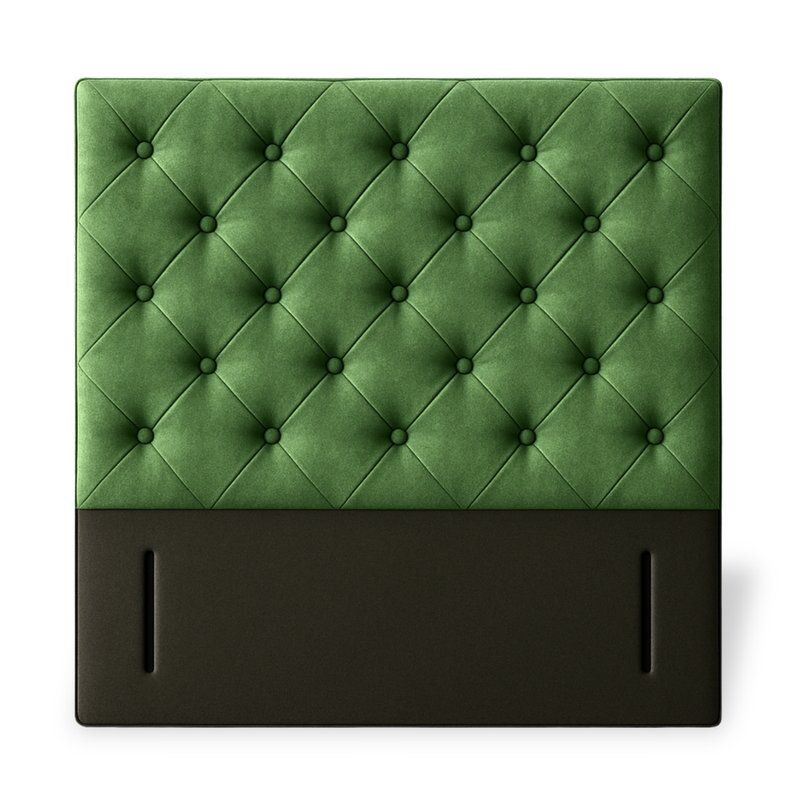 Front view of a green velvet Chester double headboard with diamond button tufting and a solid brown base.