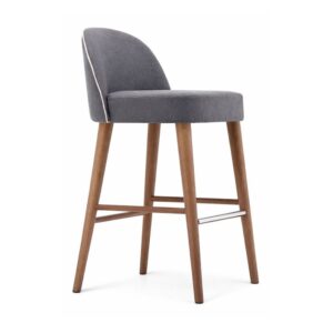 Carmen Barstool with grey upholstered seat, curved backrest, and four tapered wooden legs on a white background.