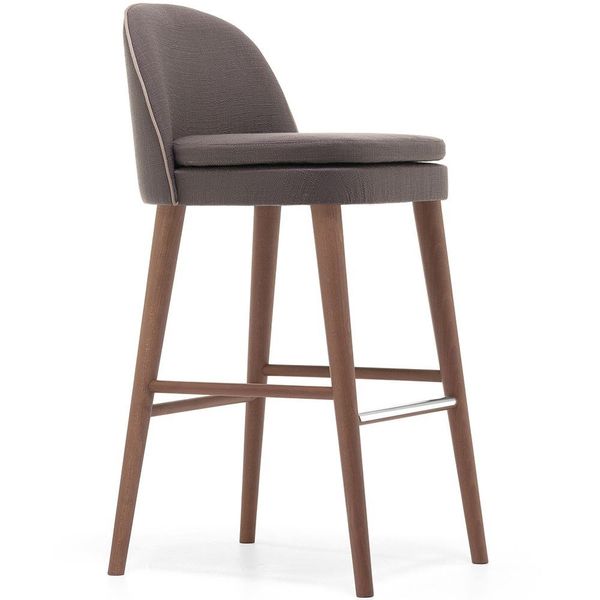 Carmen Barstool shown in profile featuring dark brown upholstery, wooden legs, and a sleek chrome footrest.
